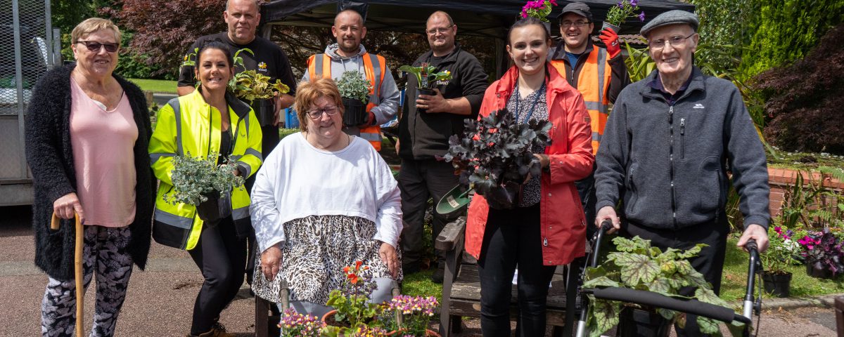 team and residents at potting day